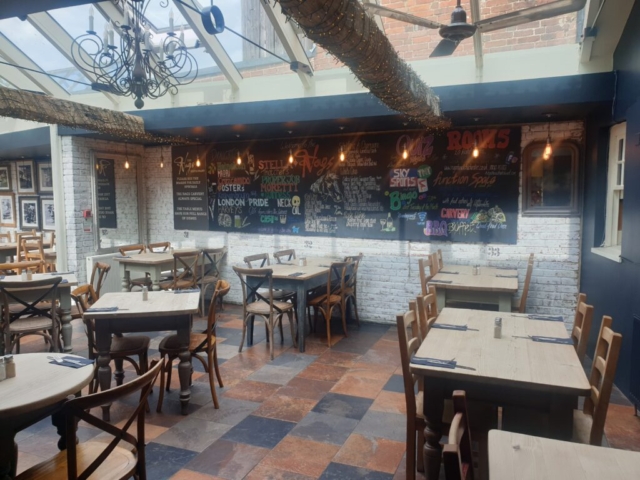 side view and decorated wall board at the nags head restaurant in chichester
